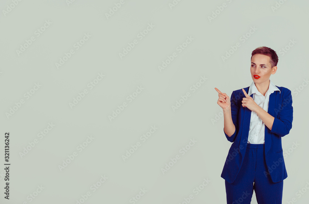 Look here. Your text product here. Portrait of attractive young woman presenting blank copy space light green white office wall background. Short hair red lips blue suit white shirt formal wear Look here. Your text product here. Portrait of attractive young woman presenting blank copy space light green white office wall background. Short hair red lips blue suit white shirt formal wear