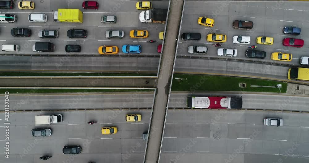 Aerial view of footbridge over traffic moving on highway, Bogota, Colombia Aerial view of footbridge over traffic moving on highway, Bogota, Colombia
