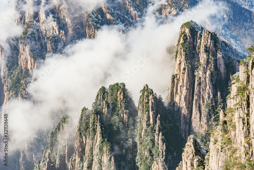 Clouds by the mountain peaks of Huangshan National park. © serjiob74