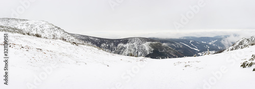 Mountain view panorama scenic in winter snow, Kozi strane, Krkonose, Czechia photo