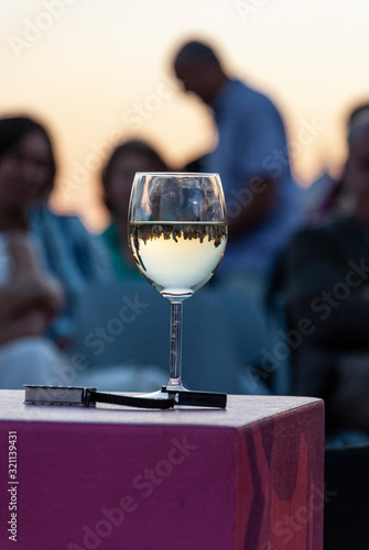 Sunset in a cup of white wine photo