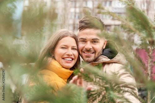 Young couple buying Christm...