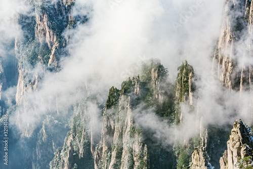 Clouds by the mountain peaks of Huangshan National park.