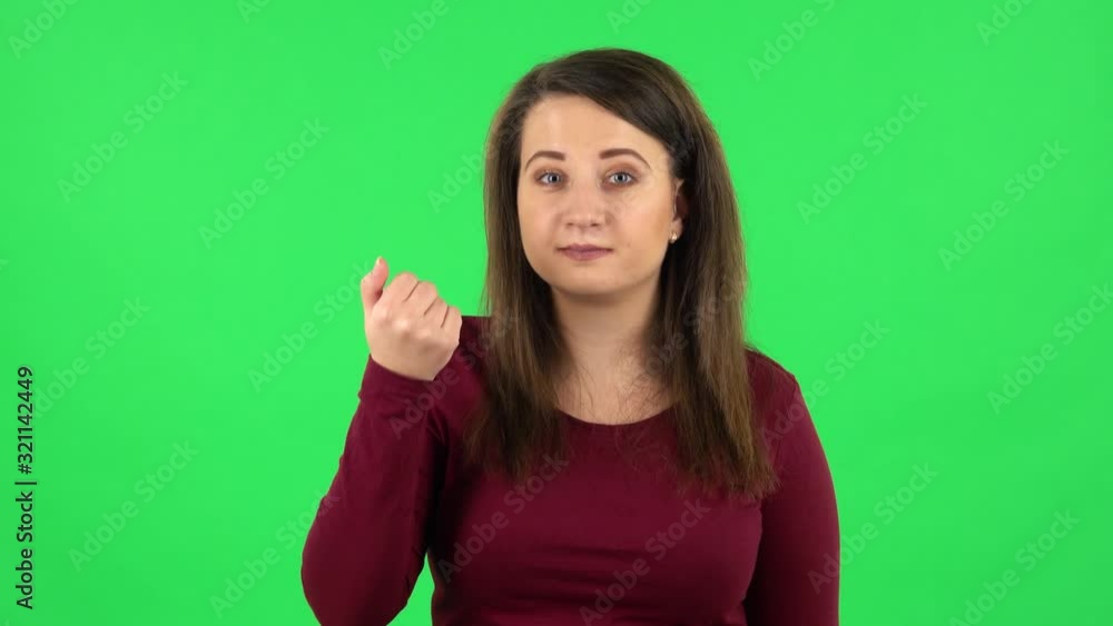Portrait of pretty girl waving hand and showing gesture come here. Green screen Portrait of pretty girl waving hand and showing gesture come here. Green screen