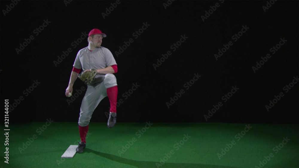SLO MO, WS, Lockdown baseball player winding up and pitching a baseball SLO MO, WS, Lockdown baseball player winding up and pitching a baseball