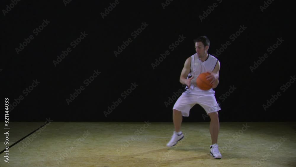 SLO MO, WS, basketball player catching, dribbling and throwing a basketball SLO MO, WS, basketball player catching, dribbling and throwing a basketball