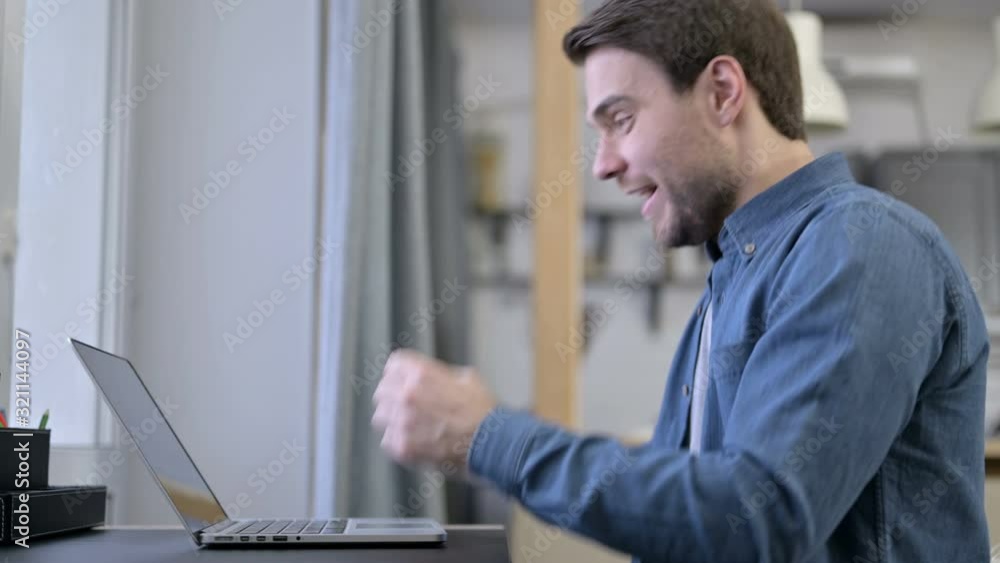 Beard Young Man Celebrating Success on Laptop Beard Young Man Celebrating Success on Laptop