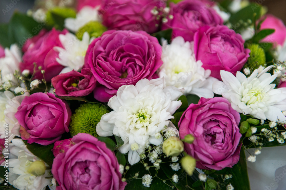 Pink and white roses and daisies. beautiful bouquet of flowers as a natural background.