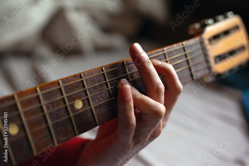 virtuoso guitarist playing his acoustic guitar
