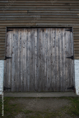 weathered wooden doors of a barn