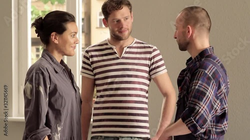 MS, TU of a young couple getting excited after meeting with an architect