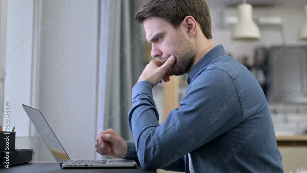 Beard Young Man Thinking and working on Laptop Beard Young Man Thinking and working on Laptop