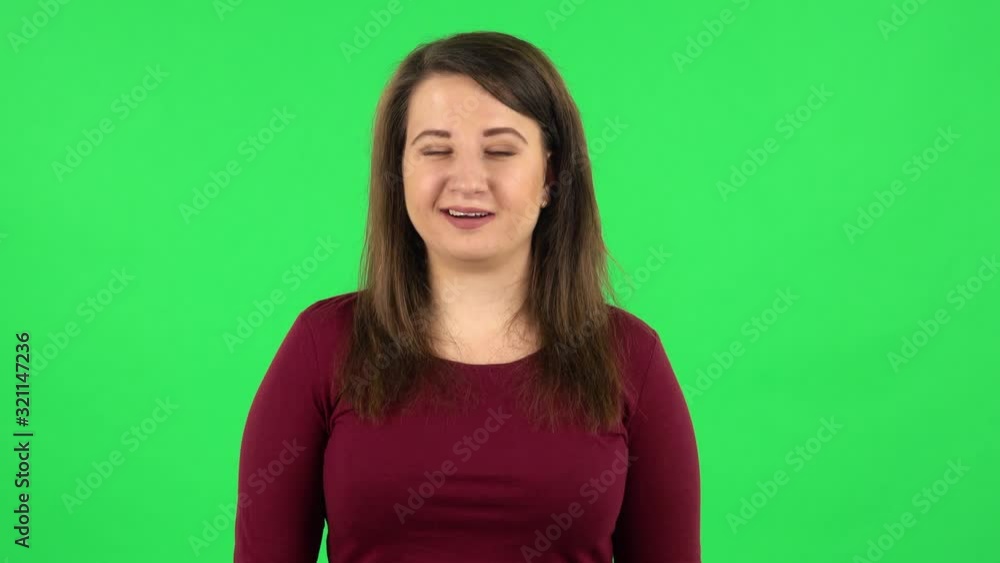 Portrait of pretty girl says wow, waves her head approvingly . Green screen Portrait of pretty girl says wow, waves her head approvingly . Green screen