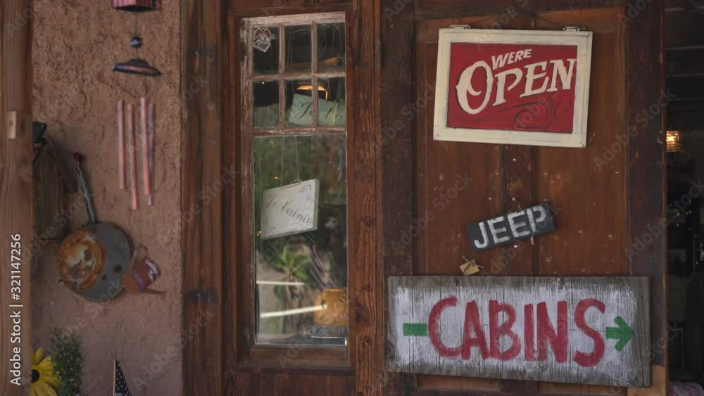 Open sign hanging on wooden door Open sign hanging on wooden door