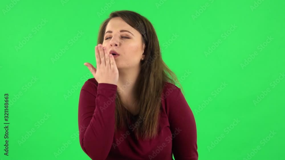 Portrait of pretty girl smiling and blowing kiss. Green screen Portrait of pretty girl smiling and blowing kiss. Green screen
