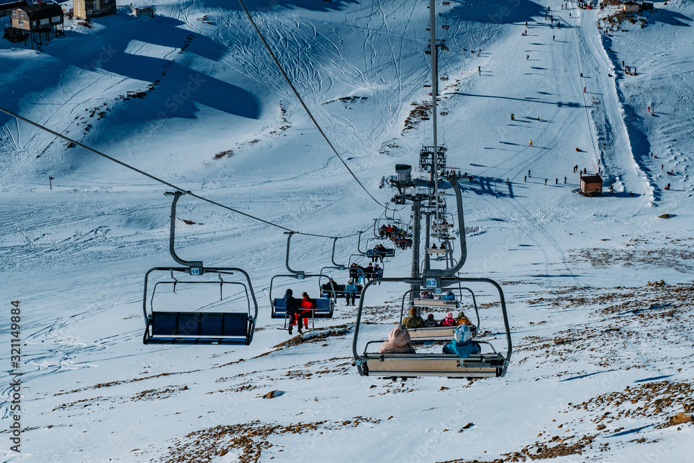 Cable car lift in mountain ski resort in winter sunny day Cable car lift in mountain ski resort in winter sunny day
