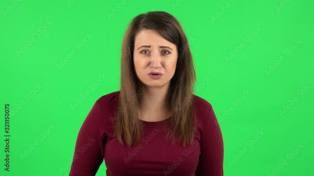 Portrait of perplexed girl in looking camera, pointing herself, say who me no thanks i do not need. Green screen Portrait of perplexed girl in looking camera, pointing herself, say who me no thanks i do not need. Green screen