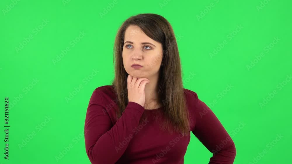 Portrait of pretty girl thinking about something, and then an idea coming to her. Green screen Portrait of pretty girl thinking about something, and then an idea coming to her. Green screen