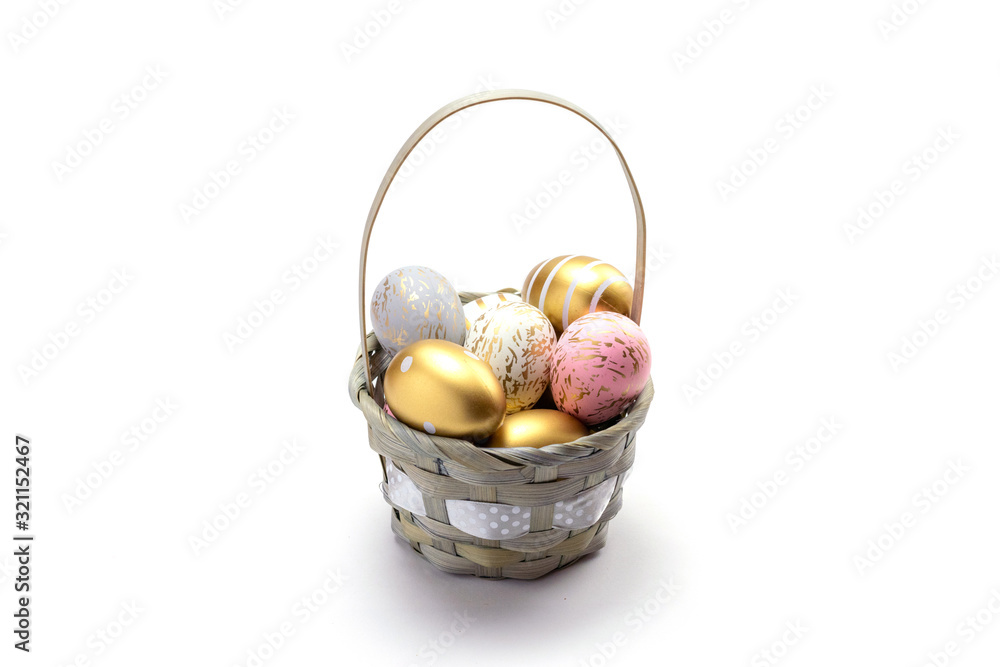 Easter egg background with golden shine decorated eggs in basket isolated on white. Happy Easter.