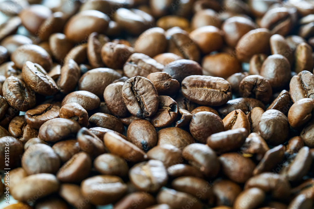 brown coffee grains close-up with blurry background brown coffee grains close-up with blurry background