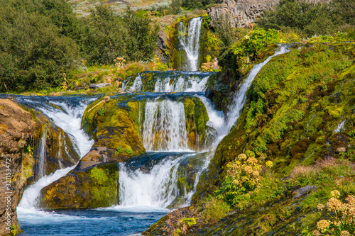 Waterfall in Gjain in thjorsardalur valley in South Iceland photo