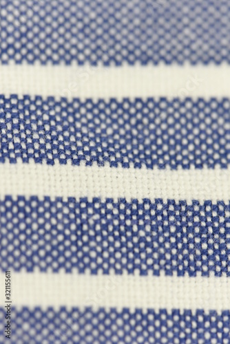 Close up texture of natural weave cloth in blue color. Fabric texture of natural cotton or linen textile material.background.