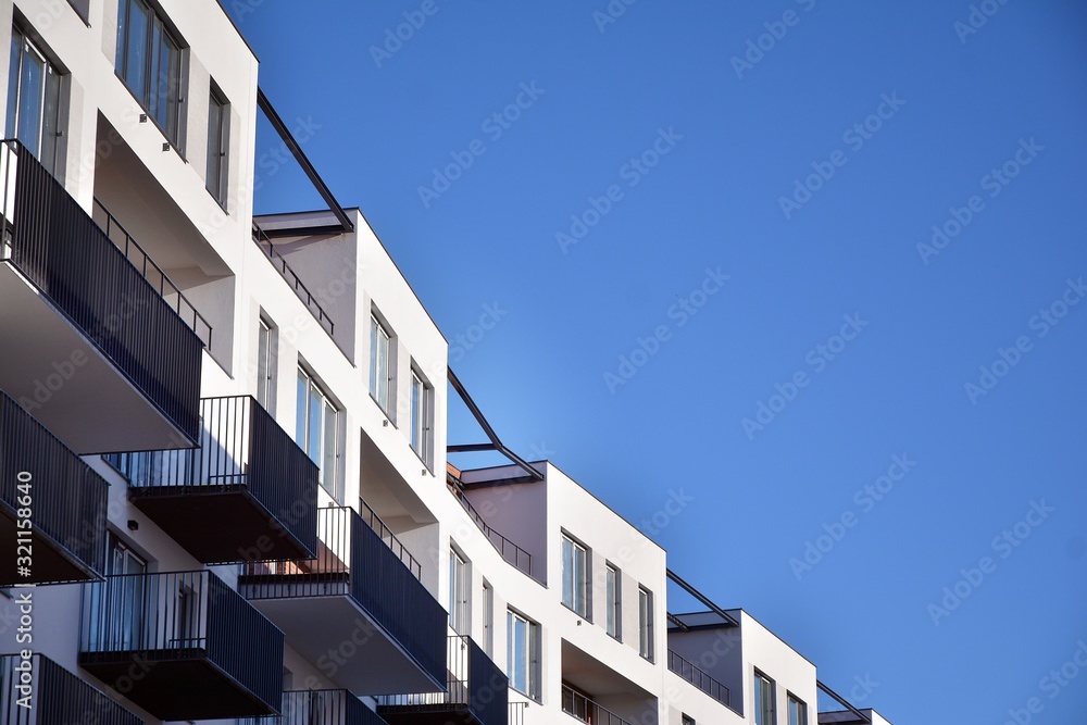 Contemporary residential building exterior in the daylight. Modern and new apartment building. 