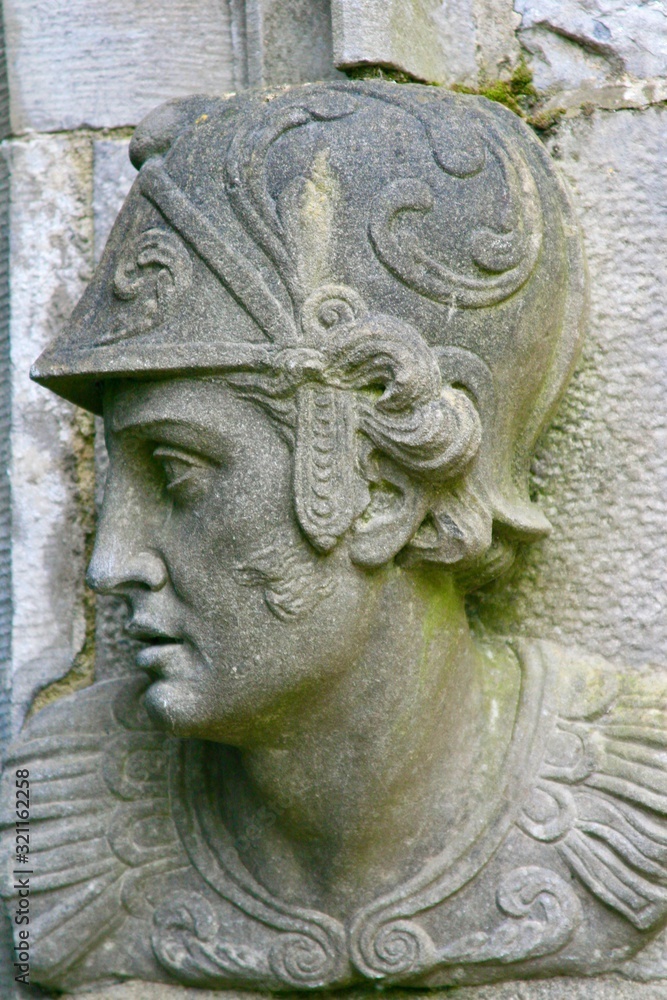 Stone head carving of soldier, guarding entrance of Kilkenny Castle Ireland