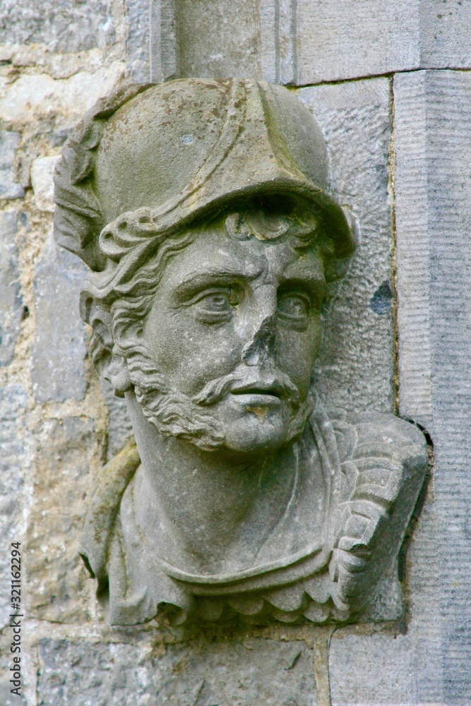 Stone head carving of guardian soldier, Kilkenny Castle Ireland Stone head carving of guardian soldier, Kilkenny Castle Ireland