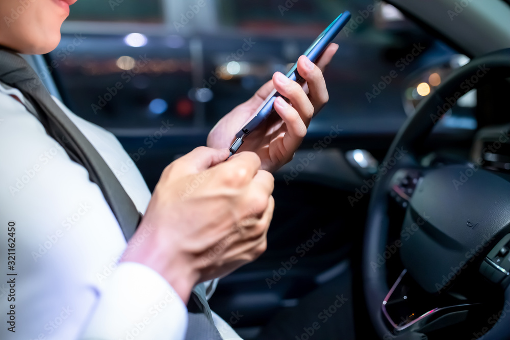 man use smartphone connecting car