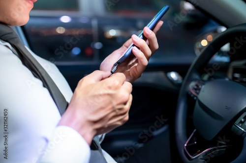 man use smartphone connecting car