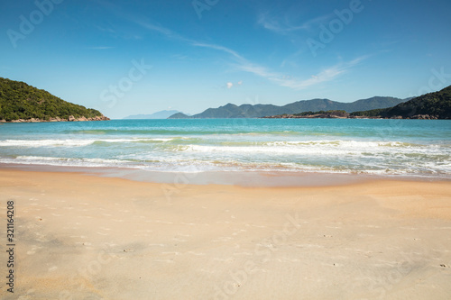 Beautiful view of Parnaioca beach in Ilha Grande, a tropical beach visited on a boat trip on the south coast of Rio de Janeiro, on the coast of Brazil during a sunny day of holidays and sightseeing. © wtondossantos