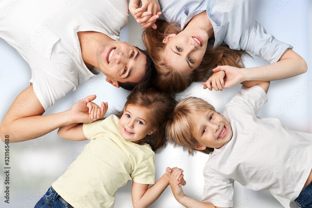 Beautiful happy family smiling at camera