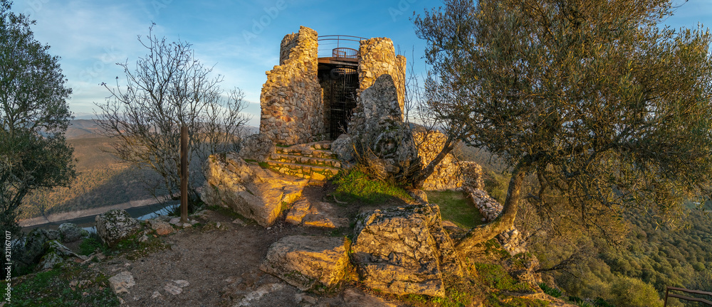 Amazing views during sunset of Extremadura countryfields, its woods and Tajo river from the awesome Monfragûe Castle a great defensive position on a hill with an old Muslim fort in the top of the hill Amazing views during sunset of Extremadura countryfields, its woods and Tajo river from the awesome Monfragûe Castle a great defensive position on a hill with an old Muslim fort in the top of the hill
