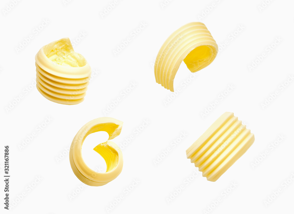 different butter curls or rolls isolated on white background. Top view.