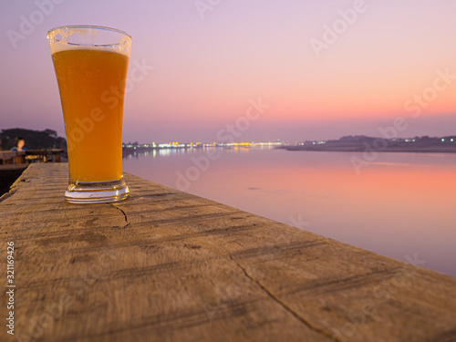 glass of beer on sunset time.