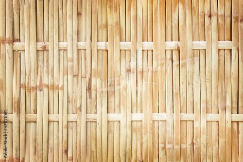 old grungy thai handcraft of bamboo weave pattern fence texture background
