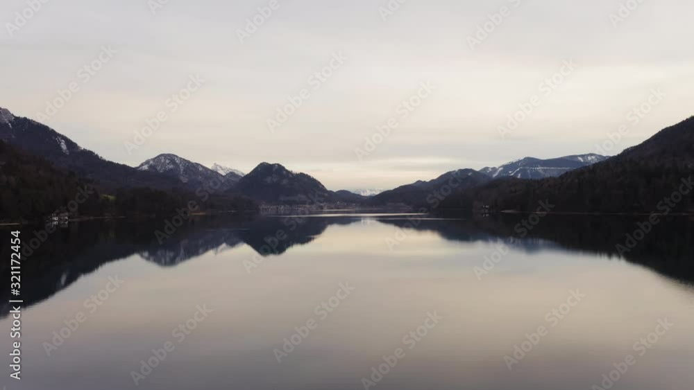 Low angle aerial dolly in above lake Fuschl on cloudy day, Austria Low angle aerial dolly in above lake Fuschl on cloudy day, Austria