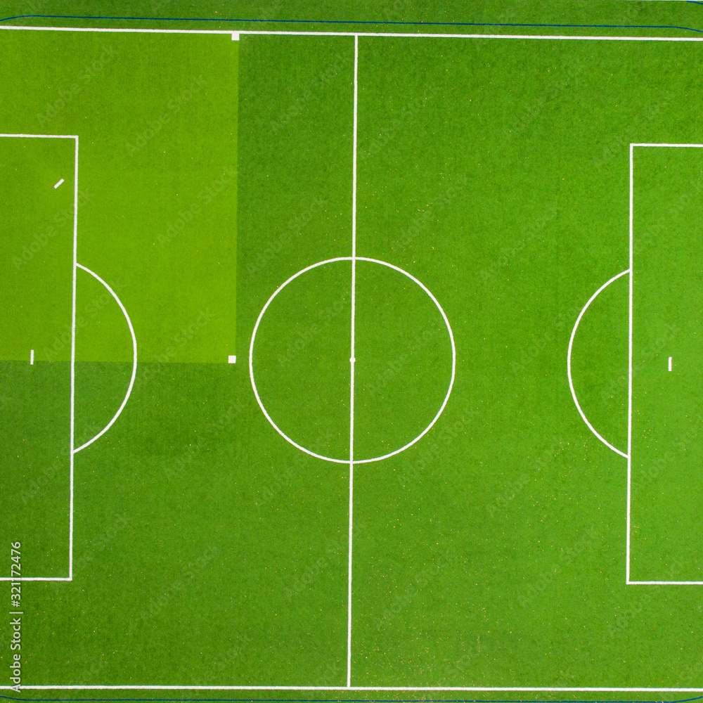 Obraz premium Texture of soccer field or soccer field. For design, top view. Green grass texture.
