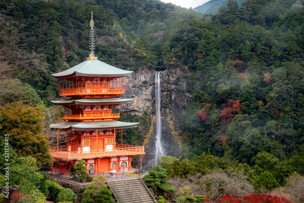 Seigantoji Pagoda in Kumano nachi taisha shrine temple with Nachi waterfalls along in view at autumn season the famous and popular tourist place in Wakayama, Japan. Japan tourism, nature life. Seigantoji Pagoda in Kumano nachi taisha shrine temple with Nachi waterfalls along in view at autumn season the famous and popular tourist place in Wakayama, Japan. Japan tourism, nature life.