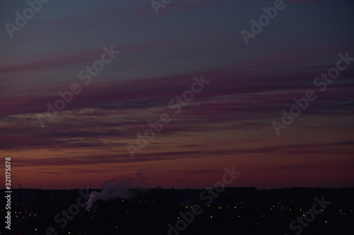 red sky of dawn view from the window in the city