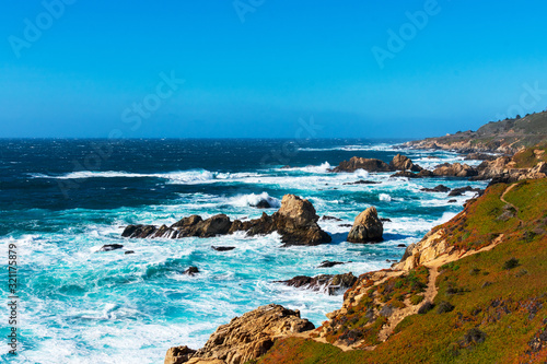 Ocean waves crash on rugged coastline