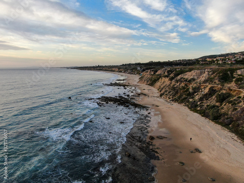 Aerial view of Newport Beach  cliff and beach during sunset twilight in southern California  USA