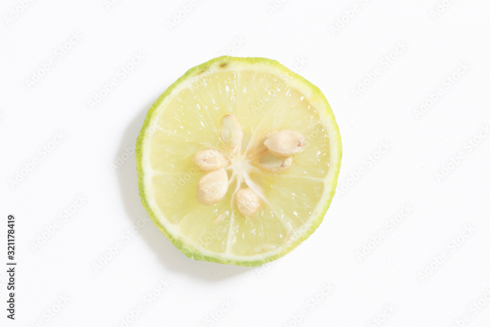 Fresh key lime on white background. Selective focus. Soft focus.
