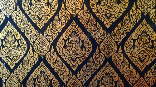 Close up  Kanok thai pattern in temple of thailand, Traditional thai painting in Buddhist temple. photo