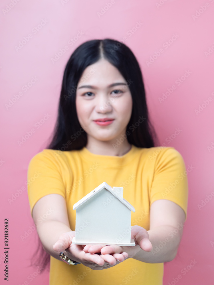 Asian woman holding house in her hands real estate concept. Asian woman holding house in her hands real estate concept.