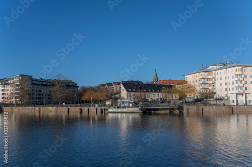 The Lake area Hammarby Sj  stad between the districts S  dermalm  Hammarby and Sickla in Nacka. Stockholm a sunny winter day. Boats  piers and houses surrounding the lake area.