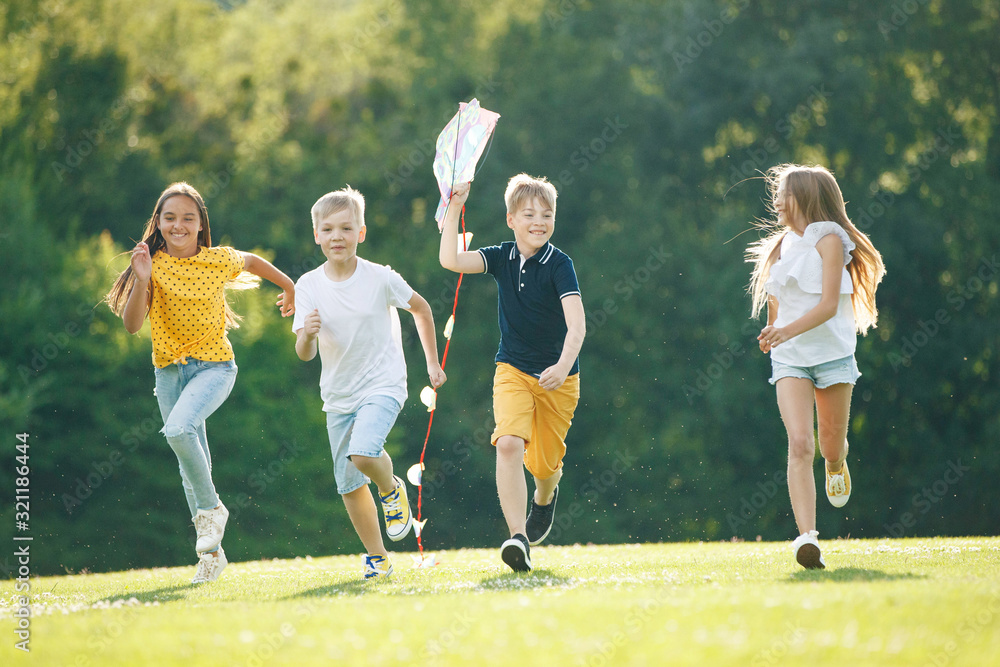 Obraz premium A group of children are playing in nature.