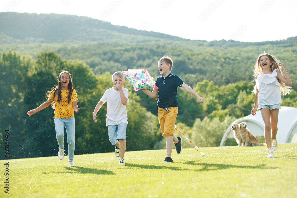 A group of children are playing in nature. A group of children are playing in nature.