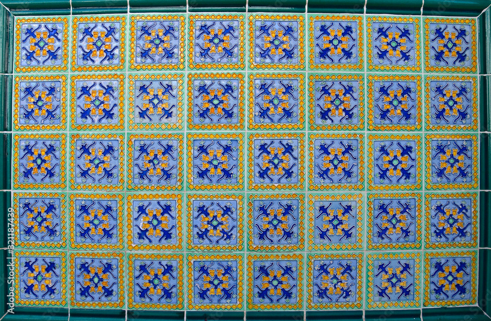 Green and blue floral peranakan tile mosaic, with green border.